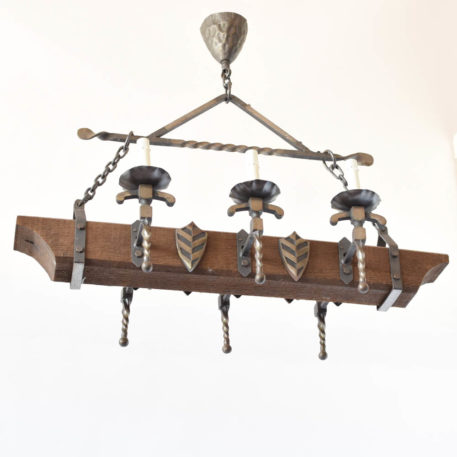 Wood chandelier with central beam and side iron arms and shield design from Belgium