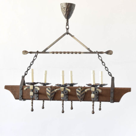 Wood chandelier with central beam and side iron arms and shield design from Belgium