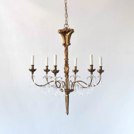 Carved wood chandelier with crystals and distressed painted finish. Genoa style