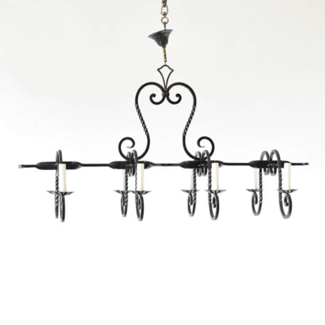 Iron chandelier with elongated form made from twisted iron bars