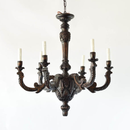 Finely carved antique wood chandelier with leaves and shells carved into main bowl of fixture