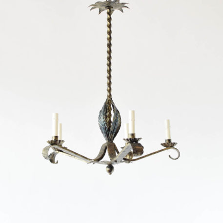 Vintage Spanish chandelier with tall twisted column and pointed forge arms with leaves underneath