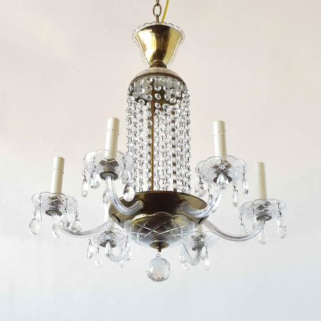 Traditional brass and glass chandelier with waterfall of beads in the middle