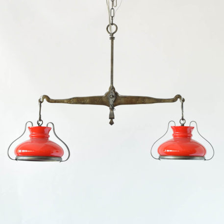 Chandelier made from an antiqure balance with red shades