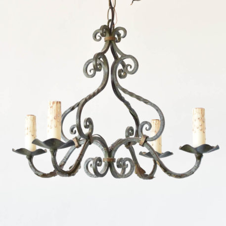 French Country chandelier with green patina and twisted metal arms