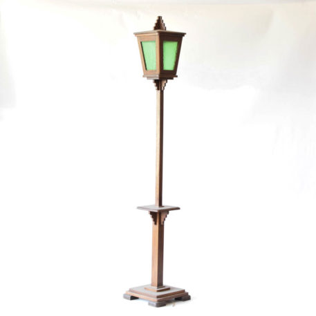 tall wooden lantern with small table