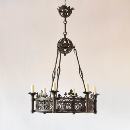 Large vintage French chandelier with clover motif throughout fixture hanging from rods and a sphere