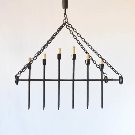 Large iron chandelier in the form of a medieval portcullis gate