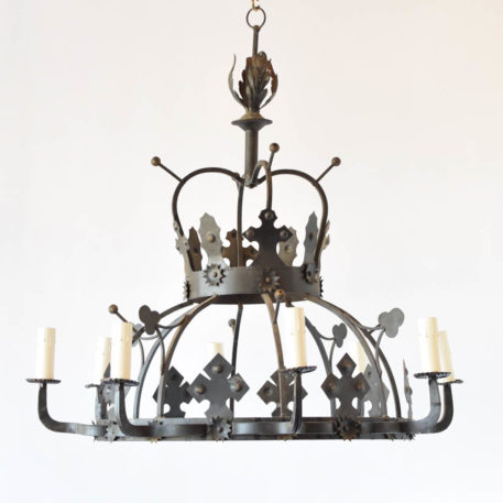 Large iron chandelier from France with an overall crown shapedecorated with crosses, stars, clovers, and iron balls