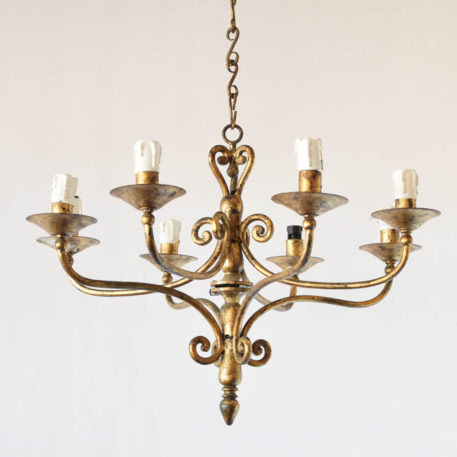 Gilded Spanish iron chandelier with 6 simple arms and lights on 2 levels. This light is from Northern Spain and was made in the mid 1900s
