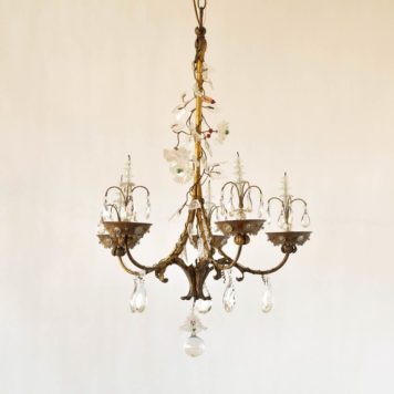 Vintage gilded iron Italian chandelier with 10 hidden lights directed at lucite flowers and leaves