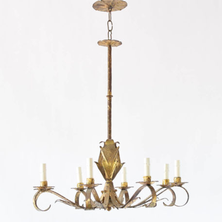 Vintage Spanish Chandelier made of gilded iron with large and small leaves on the column and arms