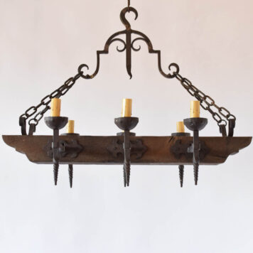 Vintage chandelier made from Antique wood beam with forged iron arms