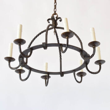 Vintage rustic iron chandelier with hand forged twisted rods and hammered details from Belgium
