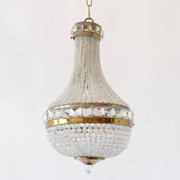 Vintage crystal chandelier in an Empire form with brass accents