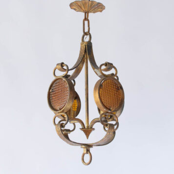 Vintage Spanish chandelier with gilded iron frame and four windows holding amber glass