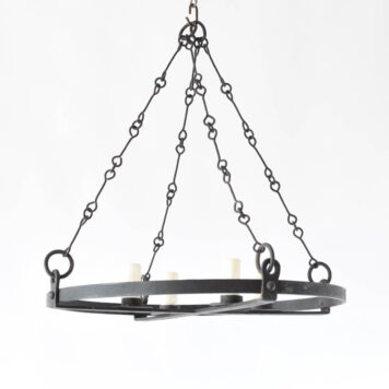 Pair of vintage iron chandeliers from France with simple band supported by interlocking rods