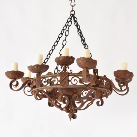 Antique French iron chandelier with shields and scrolls supporting 12 lights