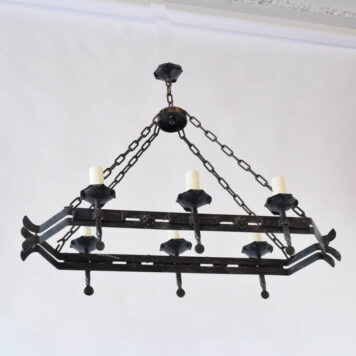 Vintage iron chandelier with 2 straps of iron forming a hexagon holding 6 torch arms