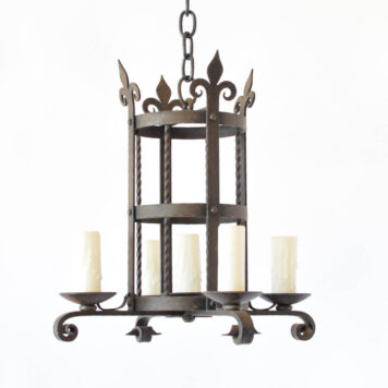 Vintage French iron chandelier with a centeral cylinder holding 4 arms and 1 center light