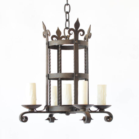 Vintage French iron chandelier with a centeral cylinder holding 4 arms and 1 center light