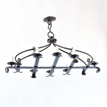 Vintage Iron chandelier with heavy strap arms with split ends and hammered and curl4ed arms supported by 4 iron bars