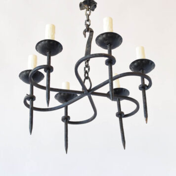 Iron chandelier with swirl design supporting 6 arms