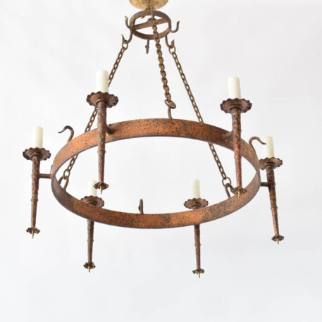 Large gilded Spanish ring chandelier with tall torches made of hammered iron with a ruffled bobesche and pointed bottom finial
