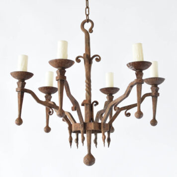 Vintage French chandelier made from hand forged iron with twisted metal details and hammered ball finials