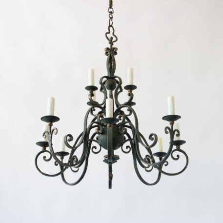 Flemish or French style pair of iron chandeliers with scroll arms and green color gold details and balls in column