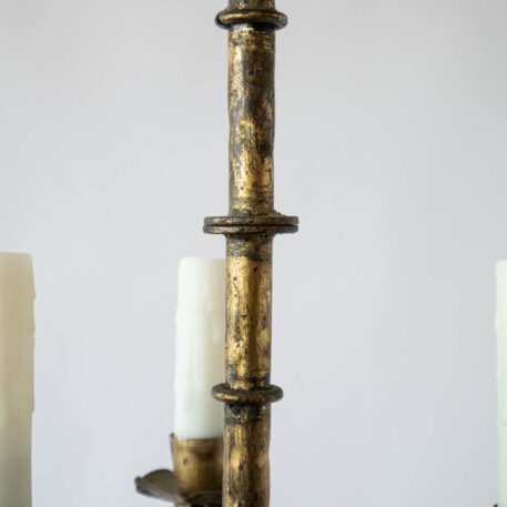 small Gilded gold Spanish style iron hall light pendant with 3 three lights and curled arms with antique gold finish rings on column