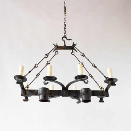 Elongated iron chandelier with 8 eight lights and 2 two down lights and hook chains hook on top curled arms rustic