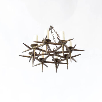 Eight light flat iron chandelier with spiky design