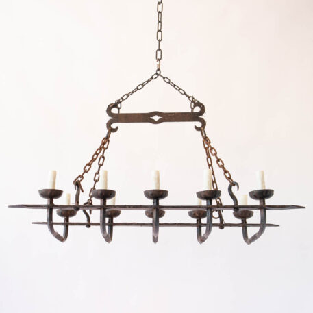 Elongated rusty iron chandelier with hooks heavy twisted wrought iron rustic simple