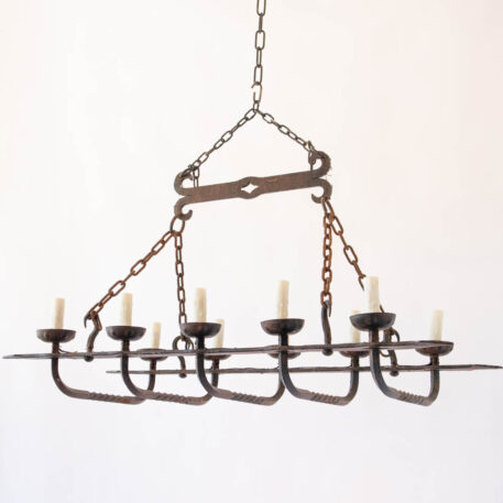 Elongated rusty iron chandelier with hooks heavy twisted wrought iron rustic simple