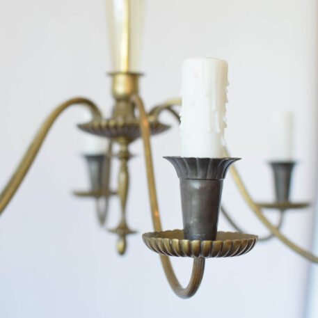 Tall thin glass column chandelier with brass arms graceful delicate narrow tall amber glass
