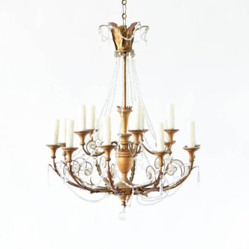 A wood and iron 15 light chandelier with crystal lines.